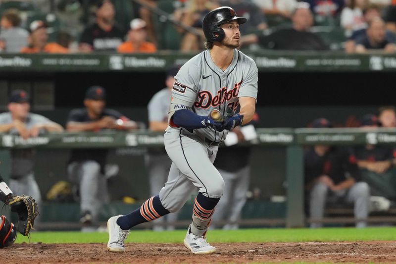 Sep 21, 2024; Baltimore, Maryland, USA; Detroit Tigers pinch hitter Zach McKinstry (39) drives in a run with a sacrifice fly ball during the tenth inning against the Baltimore Orioles at Oriole Park at Camden Yards. Mandatory Credit: Mitch Stringer-Imagn Images