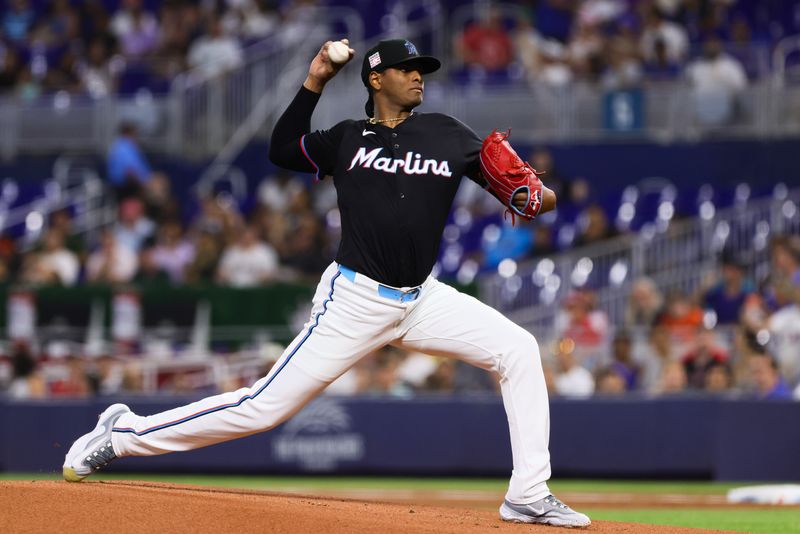 Jul 19, 2024; Miami, Florida, USA; Miami Marlins starting pitcher Edward Cabrera (27) delivers a pitch against the New York Mets during the first inning at loanDepot Park. Mandatory Credit: Sam Navarro-USA TODAY Sports