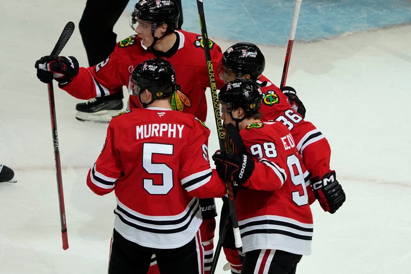 Oct 25, 2024; Chicago, Illinois, USA; Chicago Blackhawks center Connor Bedard (98) scores a goal on Nashville Predators goaltender Juuse Saros (74) during the second period at the United Center. Mandatory Credit: David Banks-Imagn Images