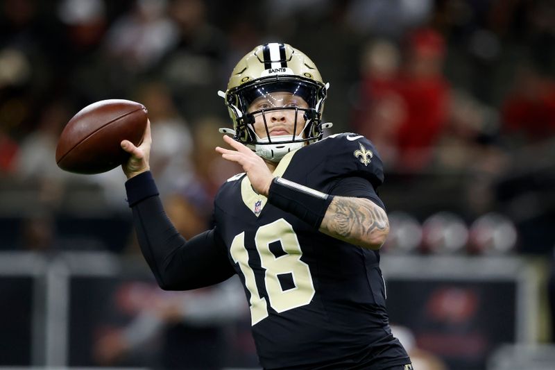 New Orleans Saints quarterback Spencer Rattler warms up before an NFL football game against the Tampa Bay Buccaneers in New Orleans, Sunday, Oct. 13, 2024. (AP Photo/Butch Dill)