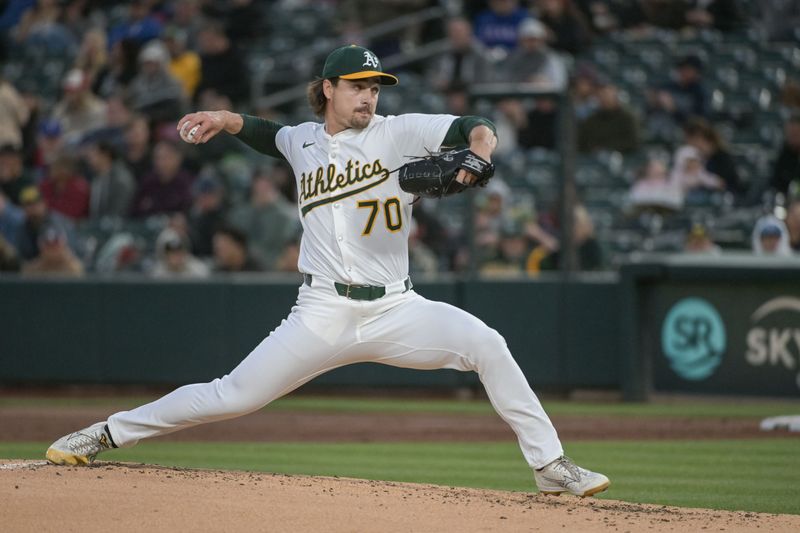 Apr 24, 2025; West Sacramento, California, USA; Athletics pitcher J.T. Ginn (70) throws a pitch against the Texas Rangers during the third inning at Sutter Health Park. Mandatory Credit: Ed Szczepanski-Imagn Images