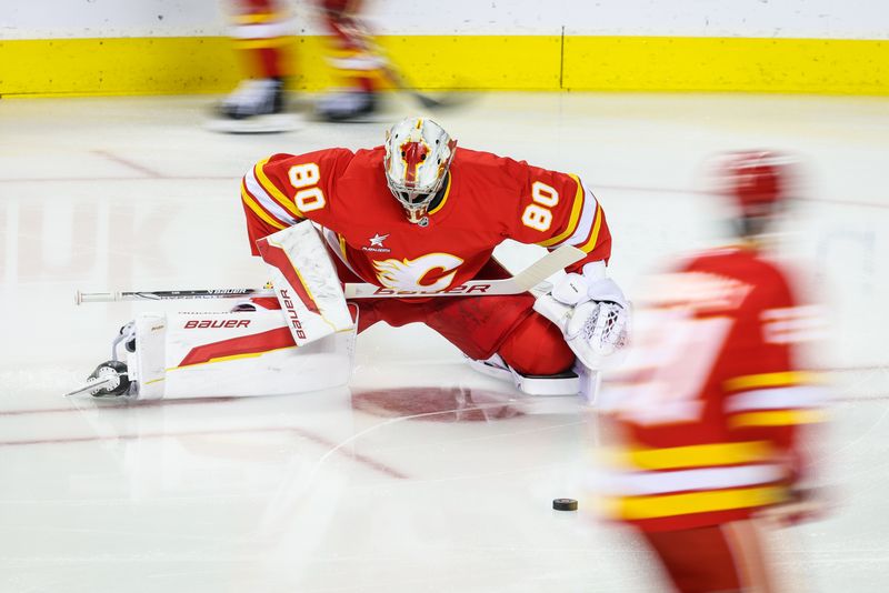 Sep 28, 2024; Calgary, Alberta, CAN; Calgary Flames goaltender Dan Vladar (80) during the warmup period against the Vancouver Canucks at Scotiabank Saddledome. Mandatory Credit: Sergei Belski-Imagn Images