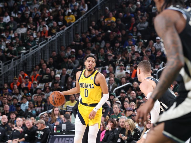 MILWAUKEE, WI - APRIL 27: Tyrese Haliburton #0 of the Indiana Pacers dribbles the ball during the game against the Milwaukee Bucks during Round One Game Four of the 2025 NBA Playoffs on April 27, 2025 at Fiserv Forum Center in Milwaukee, Wisconsin. NOTE TO USER: User expressly acknowledges and agrees that, by downloading and or using this Photograph, user is consenting to the terms and conditions of the Getty Images License Agreement. Mandatory Copyright Notice: Copyright 2025 NBAE (Photo by Jeff Haynes/NBAE via Getty Images).