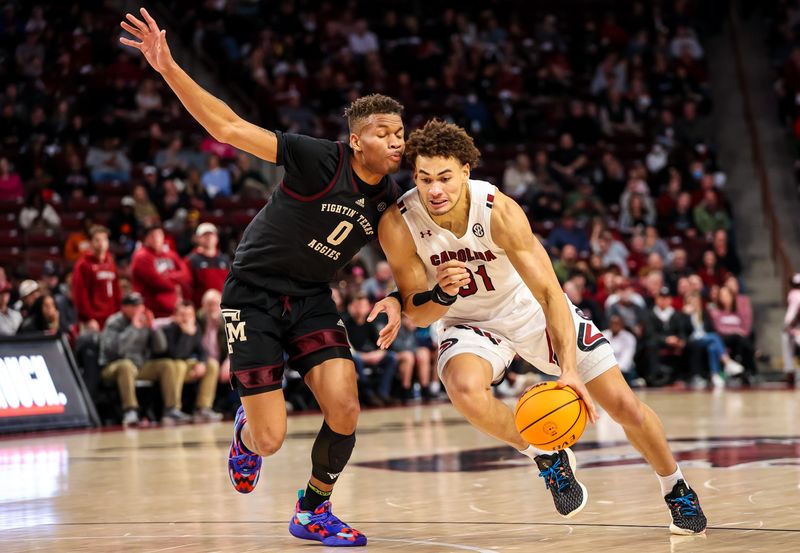 Jan 14, 2023; Columbia, South Carolina, USA; South Carolina Gamecocks forward Benjamin Bosmans-Verdonk (31) drives around Texas A&M Aggies guard Dexter Dennis (0) in the first half at Colonial Life Arena. Mandatory Credit: Jeff Blake-USA TODAY Sports