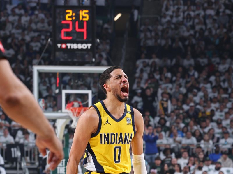 MILWAUKEE, WI - APRIL 23: Tyrese Haliburton #0 of the Indiana Pacers celebrates during Round 1 Game 2 of the 2024 NBA Playoffs against the Milwaukee Bucks on April 23, 2024 at the Fiserv Forum Center in Milwaukee, Wisconsin. NOTE TO USER: User expressly acknowledges and agrees that, by downloading and or using this Photograph, user is consenting to the terms and conditions of the Getty Images License Agreement. Mandatory Copyright Notice: Copyright 2024 NBAE (Photo by Jeff Haynes/NBAE via Getty Images).