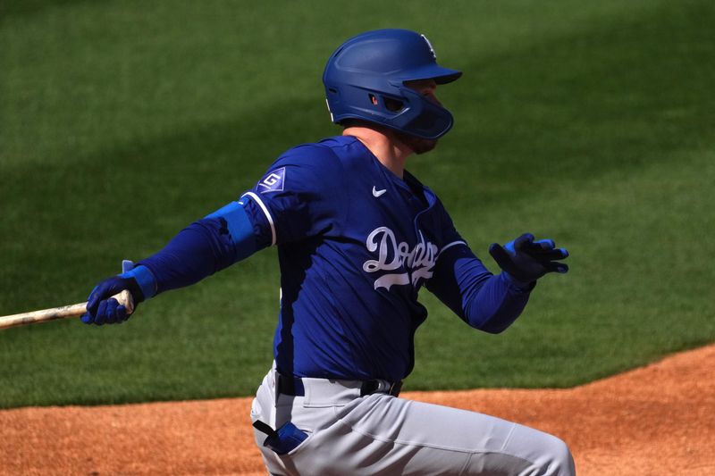 Feb 28, 2024; Surprise, Arizona, USA; Los Angeles Dodgers shortstop Gavin Lux (9) bats against the Texas Rangers during the third inning at Surprise Stadium. Mandatory Credit: Joe Camporeale-USA TODAY Sports