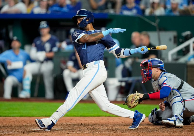 May 3, 2024; Kansas City, Missouri, USA; Kansas City Royals third base Maikel Garcia (11) hits a single against the Texas Rangers during the seventh inning at Kauffman Stadium. Mandatory Credit: Jay Biggerstaff-USA TODAY Sports