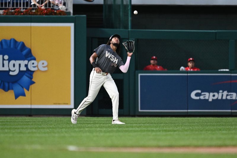 Sep 27, 2024; Washington, District of Columbia, USA;  Washington Nationals outfielder James Wood (29) makes a catch during the first inning against the Philadelphia Phillies at Nationals Park. Mandatory Credit: James A. Pittman-Imagn Images