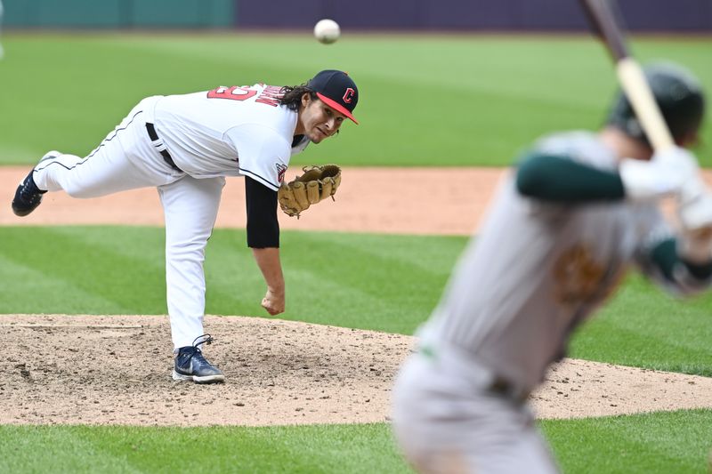 Jun 22, 2023; Cleveland, Ohio, USA; Cleveland Guardians relief pitcher Eli Morgan (49) throws a pitch to Oakland Athletics right fielder Brent Rooker (25) during the ninth inning against the Oakland Athletics at Progressive Field. Mandatory Credit: Ken Blaze-USA TODAY Sports