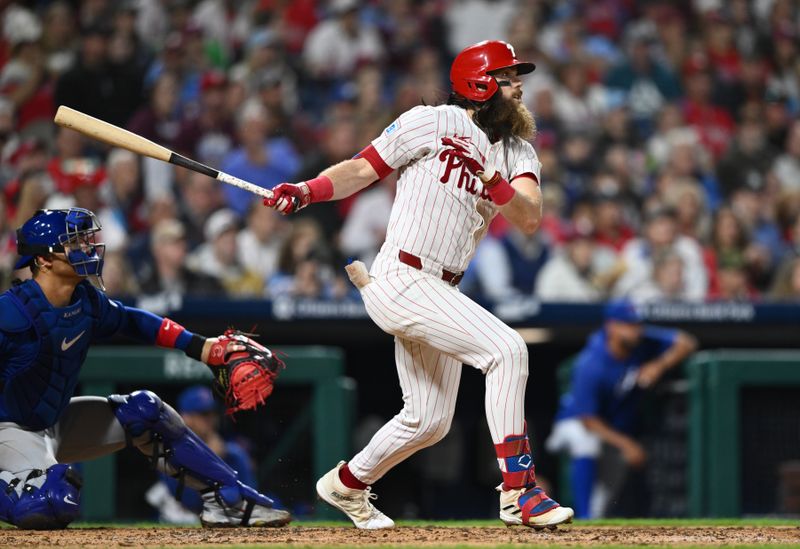 Sep 25, 2024; Philadelphia, Pennsylvania, USA; Philadelphia Phillies outfielder Brandon Marsh (16) hits an RBI double against the Chicago Cubs in the fifth inning at Citizens Bank Park. Mandatory Credit: Kyle Ross-Imagn Images