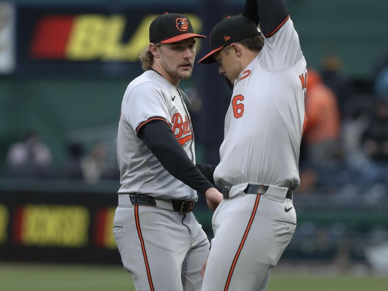 Apr 5, 2024; Pittsburgh, Pennsylvania, USA;  Baltimore Orioles shortstop Gunnar Henderson (2) and first baseman  Ryan Mountcastle (6) celebrate after defeating the Pittsburgh Pirates at PNC Park. The Orioles won 5-2. Mandatory Credit: Charles LeClaire-USA TODAY Sports