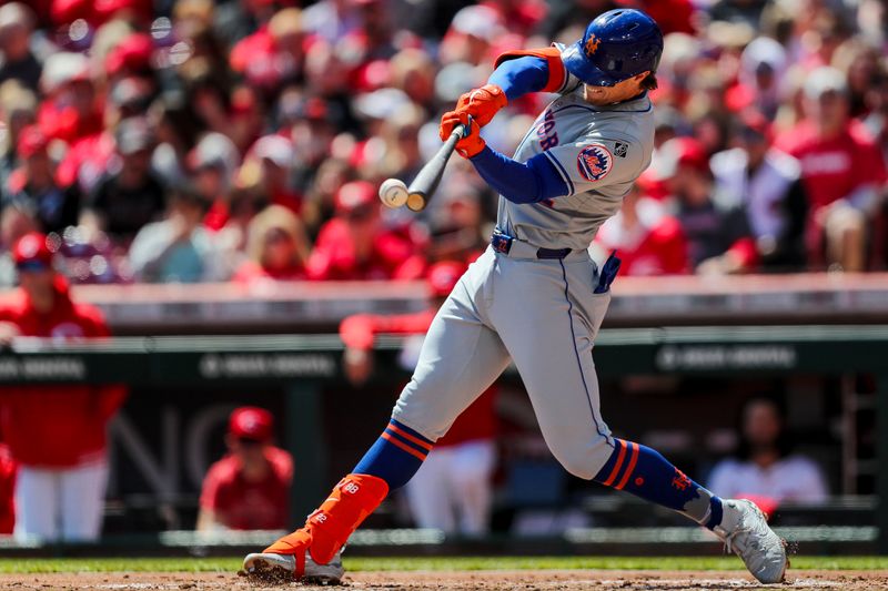 Apr 7, 2024; Cincinnati, Ohio, USA; New York Mets third baseman Brett Baty (22) hits a single in the third inning against the Cincinnati Reds at Great American Ball Park. Mandatory Credit: Katie Stratman-USA TODAY Sports