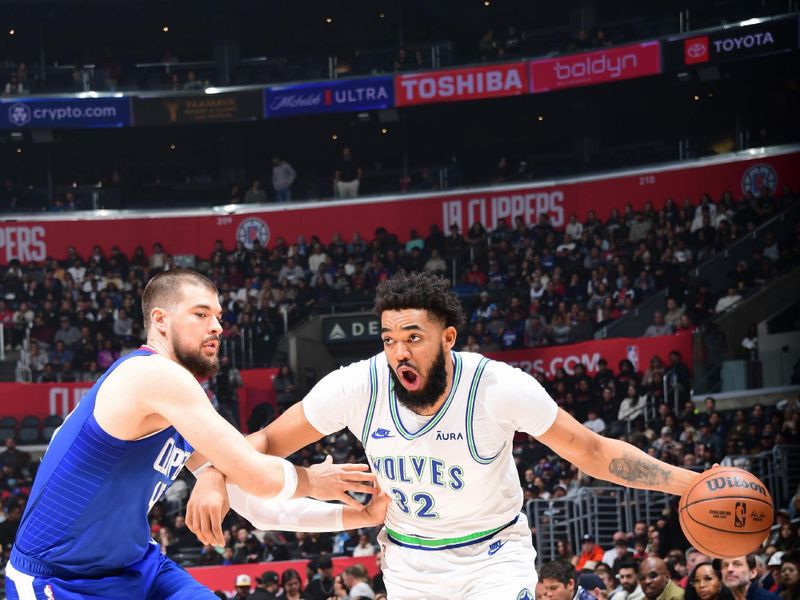 LOS ANGELES, CA - FEBRUARY 12:  Karl-Anthony Towns #32 of the Minnesota Timberwolves goes to the basket during the game on February 12, 2024 at Crypto.Com Arena in Los Angeles, California. NOTE TO USER: User expressly acknowledges and agrees that, by downloading and/or using this Photograph, user is consenting to the terms and conditions of the Getty Images License Agreement. Mandatory Copyright Notice: Copyright 2024 NBAE (Photo by Adam Pantozzi/NBAE via Getty Images)