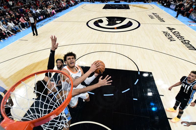 ATLANTA, GA - JANUARY 15: Dominick Barlow #26 of the San Antonio Spurs drives to the basket during the game against the Atlanta Hawks on January 15, 2024 at State Farm Arena in Atlanta, Georgia.  NOTE TO USER: User expressly acknowledges and agrees that, by downloading and/or using this Photograph, user is consenting to the terms and conditions of the Getty Images License Agreement. Mandatory Copyright Notice: Copyright 2024 NBAE (Photo by Adam Hagy/NBAE via Getty Images)