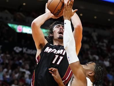 MIAMI, FLORIDA - DECEMBER 08: Jaime Jaquez Jr. #11 of the Miami Heat shoots over Isaac Okoro #35 of the Cleveland Cavaliers during the third quarter at Kaseya Center on December 08, 2023 in Miami, Florida. NOTE TO USER: User expressly acknowledges and agrees that, by downloading and or using this photograph, User is consenting to the terms and condtions of the Getty Images License Agreement.  (Photo by Rich Storry/Getty Images)