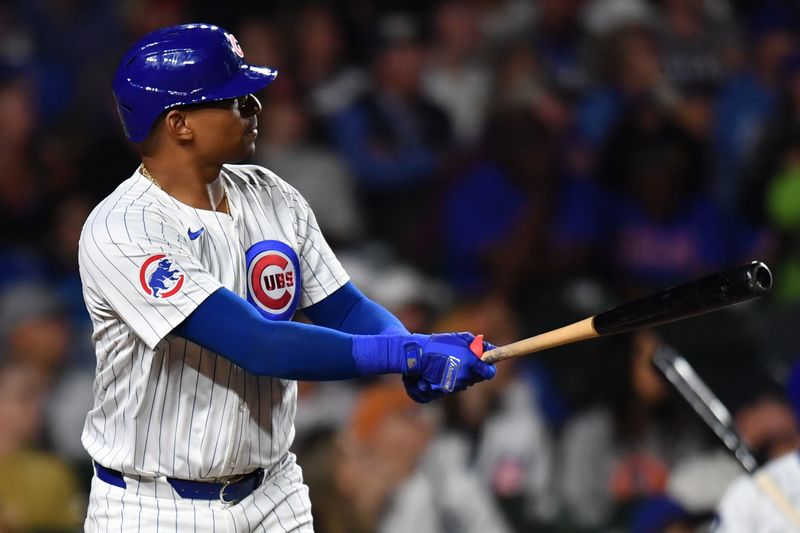 Aug 21, 2024; Chicago, Illinois, USA; Chicago Cubs catcher Christian Bethancourt (60) hits a two-run home run during the fifth inning against the Detroit Tigers at Wrigley Field. Mandatory Credit: Patrick Gorski-USA TODAY Sports