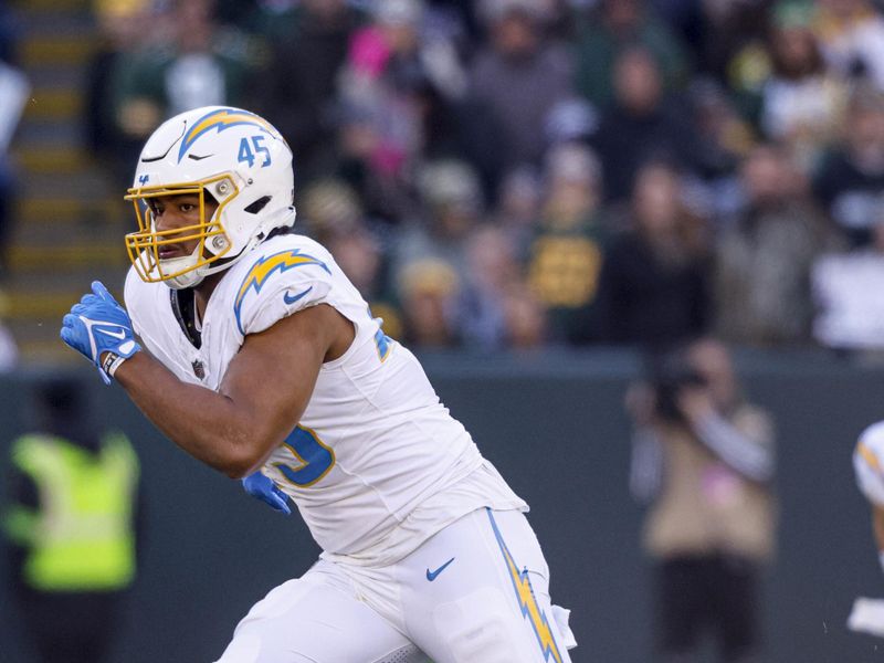 Los Angeles Chargers linebacker Tuli Tuipulotu (45) plays defense during an NFL football game against the Green Bay Packers Sunday, Nov. 19, 2023, in Green Bay, Wis. (AP Photo/Jeffrey Phelps