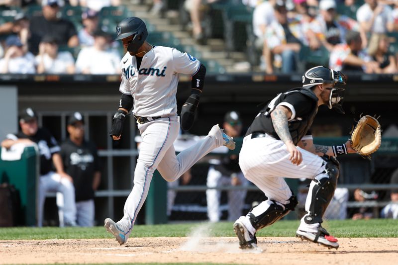 Jun 10, 2023; Chicago, Illinois, USA; Miami Marlins first baseman Yuli Gurriel (10) scores against the Chicago White Sox during the ninth inning at Guaranteed Rate Field. Mandatory Credit: Kamil Krzaczynski-USA TODAY Sports