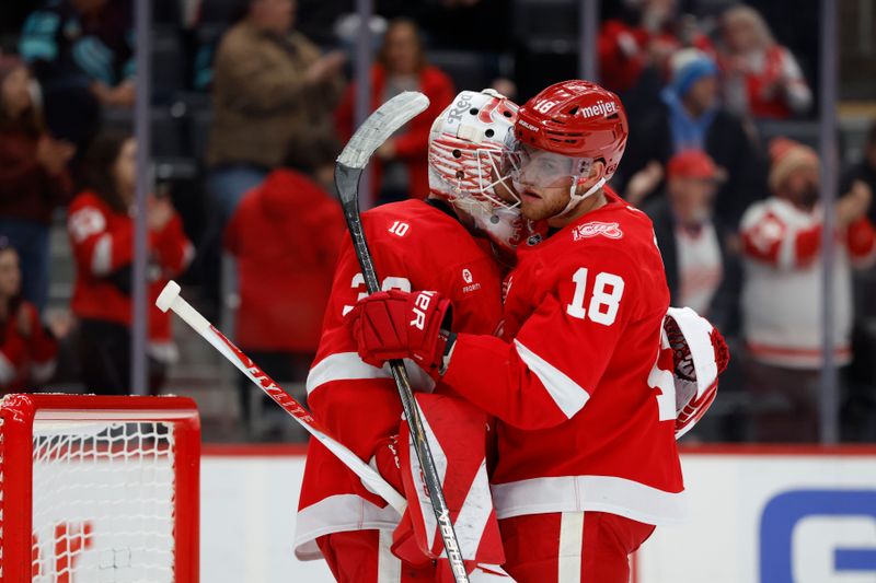 Nov 18, 2025; Detroit, Michigan, USA; Detroit Red Wings goaltender Cam Talbot (39) and Detroit Red Wings center Andrew Copp (18) celebrate defeating the Seattle Kraken  at Little Caesars Arena. Mandatory Credit: Rick Osentoski-Imagn Images