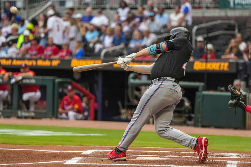 Aug 2, 2024; Cumberland, Georgia, USA; Miami Marlins first baseman Jonah Bride (41) hits a two run home run against the Atlanta Braves during the first inning at Truist Park. Mandatory Credit: Dale Zanine-USA TODAY Sports