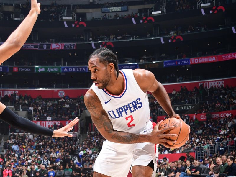 LOS ANGELES, CA - MARCH 17: Kawhi Leonard #2 of the LA Clippers handles the ball during the game against the Atlanta Hawks on March 17, 2024 at Crypto.Com Arena in Los Angeles, California. NOTE TO USER: User expressly acknowledges and agrees that, by downloading and/or using this Photograph, user is consenting to the terms and conditions of the Getty Images License Agreement. Mandatory Copyright Notice: Copyright 2024 NBAE (Photo by Adam Pantozzi/NBAE via Getty Images)