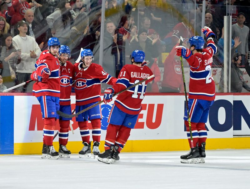 Jan 6, 2025; Montreal, Quebec, CAN; Montreal Canadiens forward Nick Suzuki (14) celebrates with teammates including defenseman Lane Hutson (48) and forward Brendan Gallagher (11) after scoring the winning goal against the Vancouver Canucks during the overtime period at the Bell Centre. Mandatory Credit: Eric Bolte-Imagn Images