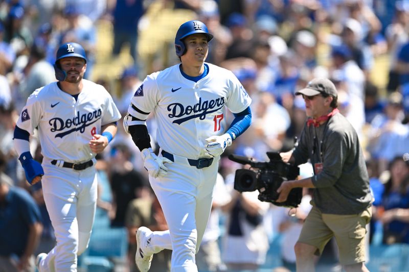 Apr 21, 2024; Los Angeles, California, USA; Los Angeles Dodgers designated hitter Shohei Ohtani (17) his a one run home run against the New York Mets during the third inning at Dodger Stadium. Mandatory Credit: Jonathan Hui-USA TODAY Sports