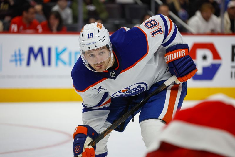 Oct 27, 2024; Detroit, Michigan, USA; Edmonton Oilers left wing Zach Hyman (18) looks on during a face off in the third period of the game against the Detroit Red Wings at Little Caesars Arena. Mandatory Credit: Brian Bradshaw Sevald-Imagn Images