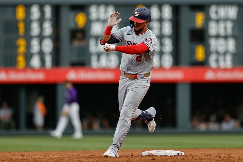 Jun 21, 2024; Denver, Colorado, USA; Washington Nationals second baseman Luis Garcia Jr. (2) reacts as he rounds second on a three run home run in the third inning against the Colorado Rockies at Coors Field. Mandatory Credit: Isaiah J. Downing-USA TODAY Sports