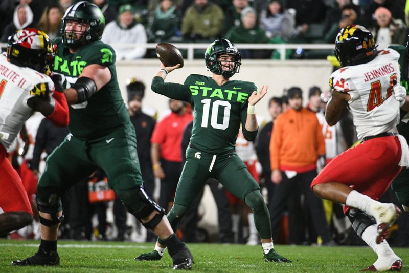 Nov 13, 2021; East Lansing, Michigan, USA; Michigan State Spartans quarterback Payton Thorne (10) drops back to throw the ball during the third quarter against the Maryland Terrapins at Spartan Stadium. Mandatory Credit: Tim Fuller-USA TODAY Sports
