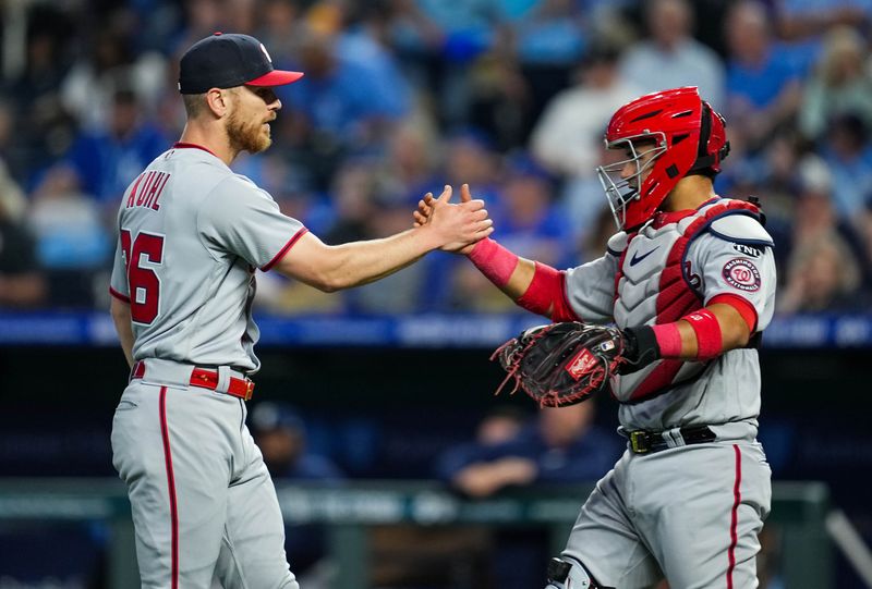 May 26, 2023; Kansas City, Missouri, USA; Washington Nationals starting pitcher Chad Kuhl (26) celebrates with catcher Keibert Ruiz (20) after defeating the Kansas City Royals at Kauffman Stadium. Mandatory Credit: Jay Biggerstaff-USA TODAY Sports