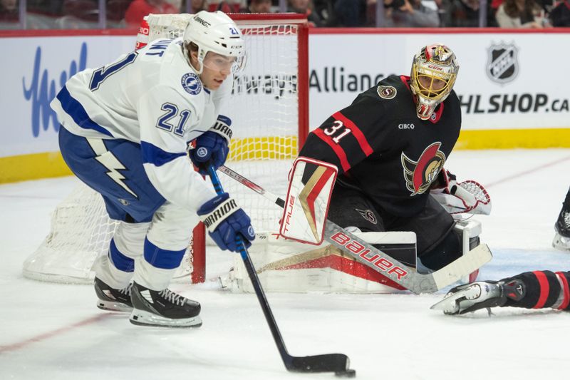 Nov 4, 2023; Ottawa, Ontario, CAN; Tampa Bay Lightning center Brayden Point (21) skates with the puck in front of Ottawa Senators goalie Anton Forsberg (31) in the second period at the Canadian Tire Centre. Mandatory Credit: Marc DesRosiers-USA TODAY Sports