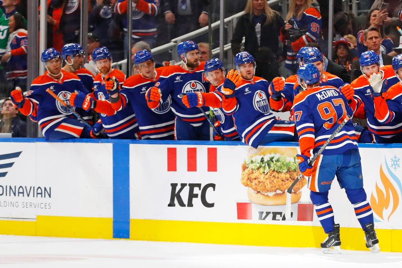 Oct 22, 2024; Edmonton, Alberta, CAN; The Edmonton Oilers celebrate a goal scored by forward Connor McDavid (97) during the first period against the Carolina Hurricanes at Rogers Place. Mandatory Credit: Perry Nelson-Imagn Images