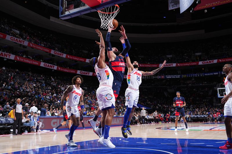 PHILADELPHIA, PA - JANUARY 8: Jonas Valanciunas #17 of the Washington Wizards drives to the basket during the game against the Philadelphia 76ers on January 8, 2025 at the Wells Fargo Center in Philadelphia, Pennsylvania NOTE TO USER: User expressly acknowledges and agrees that, by downloading and/or using this Photograph, user is consenting to the terms and conditions of the Getty Images License Agreement. Mandatory Copyright Notice: Copyright 2025 NBAE (Photo by Jesse D. Garrabrant/NBAE via Getty Images)