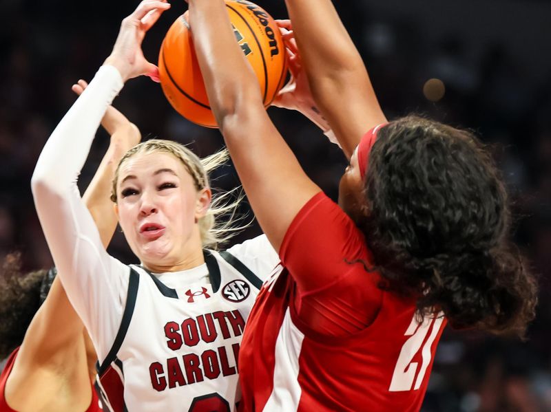 Feb 22, 2024; Columbia, South Carolina, USA; Alabama Crimson Tide forward Essence Cody (21) blocks the shot of South Carolina Gamecocks forward Chloe Kitts (21) in the first half at Colonial Life Arena. Mandatory Credit: Jeff Blake-USA TODAY Sports