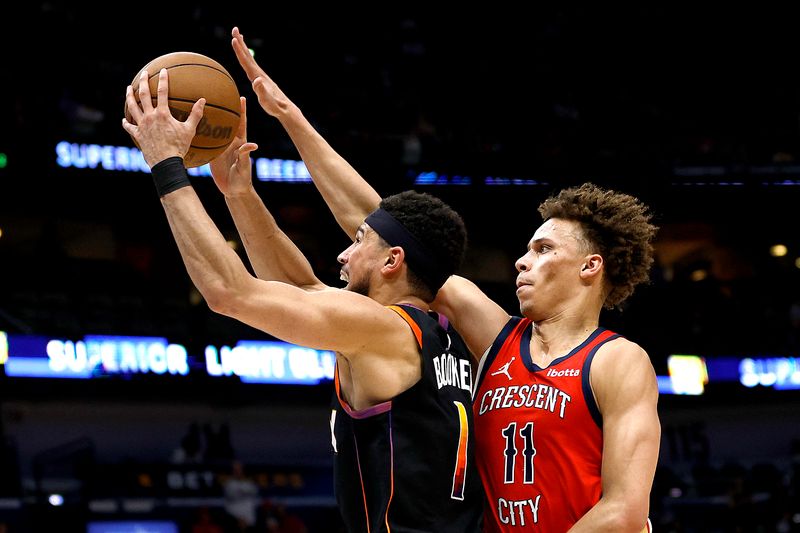 NEW ORLEANS, LOUISIANA - APRIL 01: Devin Booker #1 of the Phoenix Suns shoots over Dyson Daniels #11 of the New Orleans Pelicansduring the fourthquarter of an NBA game at Smoothie King Center on April 01, 2024 in New Orleans, Louisiana. NOTE TO USER: User expressly acknowledges and agrees that, by downloading and or using this photograph, User is consenting to the terms and conditions of the Getty Images License Agreement. (Photo by Sean Gardner/Getty Images)