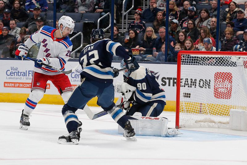 Feb 25, 2024; Columbus, Ohio, USA; Columbus Blue Jackets goalie Elvis Merzlikins (90) makes a save as New York Rangers left wing Chris Kreider (20) looks for a rebound during the second period at Nationwide Arena. Mandatory Credit: Russell LaBounty-USA TODAY Sports