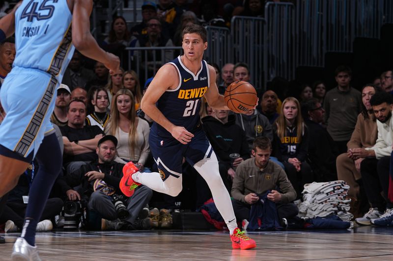 DENVER, CO - MARCH 25: Collin Gillespie #21 of the Denver Nuggets handles the ball during the game against the Memphis Grizzlies on March 25, 2024 at the Ball Arena in Denver, Colorado. NOTE TO USER: User expressly acknowledges and agrees that, by downloading and/or using this Photograph, user is consenting to the terms and conditions of the Getty Images License Agreement. Mandatory Copyright Notice: Copyright 2024 NBAE (Photo by Bart Young/NBAE via Getty Images)