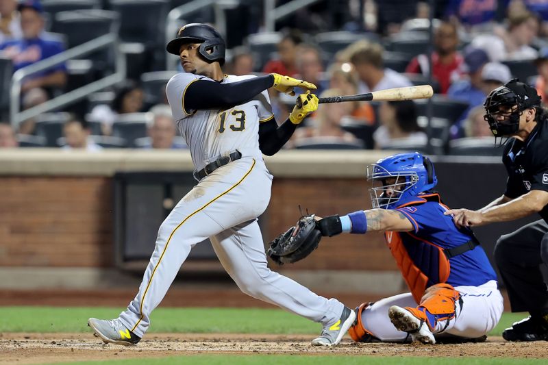 Aug 14, 2023; New York City, New York, USA; Pittsburgh Pirates third baseman Ke'Bryan Hayes (13) follows through on an RBI double against the New York Mets during the third inning at Citi Field. Mandatory Credit: Brad Penner-USA TODAY Sports