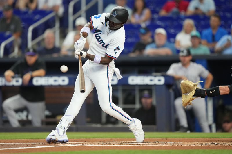 May 2, 2024; Miami, Florida, USA;  Miami Marlins center fielder Jazz Chisholm Jr. (2) hits a single in the first inning against the Colorado Rockies at loanDepot Park. Mandatory Credit: Jim Rassol-USA TODAY Sports