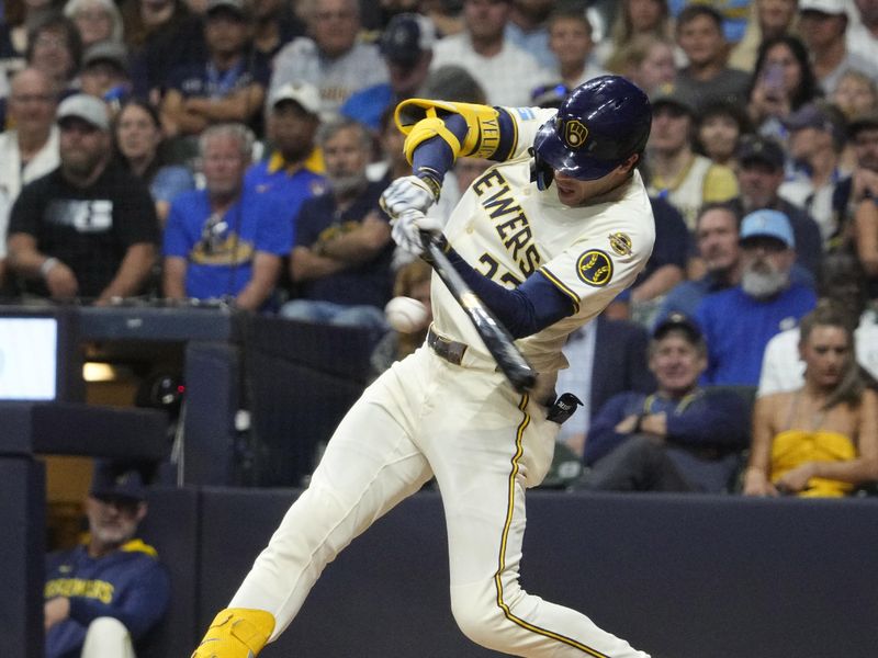 Sep 18, 2025; Milwaukee, Wisconsin, USA; Milwaukee Brewers outfielder Christian Yelich (22) hits a double against the Los Angeles Angels in the sixth inning at American Family Field. Mandatory Credit: Michael McLoone-Imagn Images