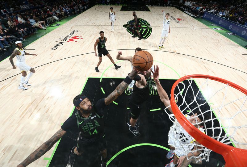 NEW ORLEANS, LA - JANUARY 23: Brandon Ingram #14 and Jonas Valanciunas #17 of the New Orleans Pelicans grabs a rebound during the game against the Utah Jazz on January 23, 2024 at the Smoothie King Center in New Orleans, Louisiana. NOTE TO USER: User expressly acknowledges and agrees that, by downloading and or using this Photograph, user is consenting to the terms and conditions of the Getty Images License Agreement. Mandatory Copyright Notice: Copyright 2024 NBAE (Photo by Layne Murdoch Jr./NBAE via Getty Images)