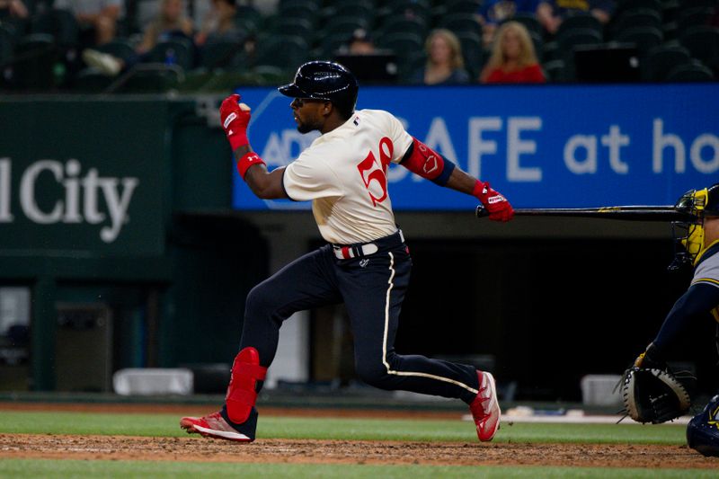 Aug 18, 2023; Arlington, Texas, USA; Texas Rangers center fielder J.P. Martinez (50) drives in a run against the Milwaukee Brewers during the ninth inning at Globe Life Field. Mandatory Credit: Jerome Miron-USA TODAY Sports