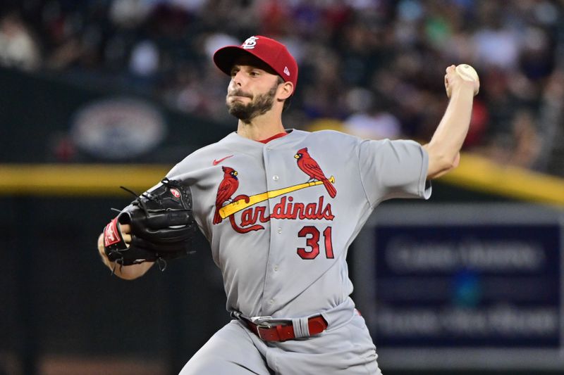 Jul 26, 2023; Phoenix, Arizona, USA;  St. Louis Cardinals starting pitcher Andrew Suarez (31) throws in the ninth inning against the Arizona Diamondbacks at Chase Field. Mandatory Credit: Matt Kartozian-USA TODAY Sports