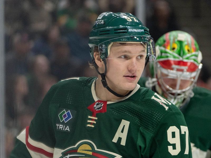 Dec 14, 2023; Saint Paul, Minnesota, USA; Minnesota Wild left wing Kirill Kaprizov (97) congratulates Minnesota Wild goaltender Filip Gustavsson (32) on a save in the first period against the Calgary Flames at Xcel Energy Center. Mandatory Credit: Matt Blewett-USA TODAY Sports