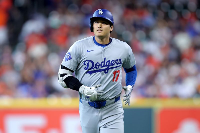 Jul 28, 2024; Houston, Texas, USA; Los Angeles Dodgers designated hitter Shohei Ohtani (17) runs back to the dugout after hitting a fly ball for an out against the Houston Astros during the first inning at Minute Maid Park. Mandatory Credit: Erik Williams-USA TODAY Sports