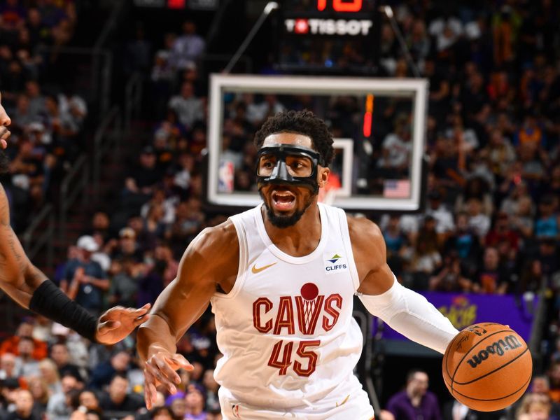 PHOENIX, AZ - APRIL 3:  Donovan Mitchell #45 of the Cleveland Cavaliers handles the ball during the game  on April 3, 2024 at Footprint Center in Phoenix, Arizona. NOTE TO USER: User expressly acknowledges and agrees that, by downloading and or using this photograph, user is consenting to the terms and conditions of the Getty Images License Agreement. Mandatory Copyright Notice: Copyright 2024 NBAE (Photo by Barry Gossage/NBAE via Getty Images)