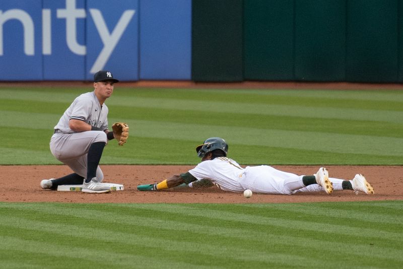 Jun 27, 2023; Oakland, California, USA; Oakland Athletics center fielder Esteury Ruiz (1) steals second base during the third inning against the New York Yankees at Oakland-Alameda County Coliseum. Mandatory Credit: Ed Szczepanski-USA TODAY Sports