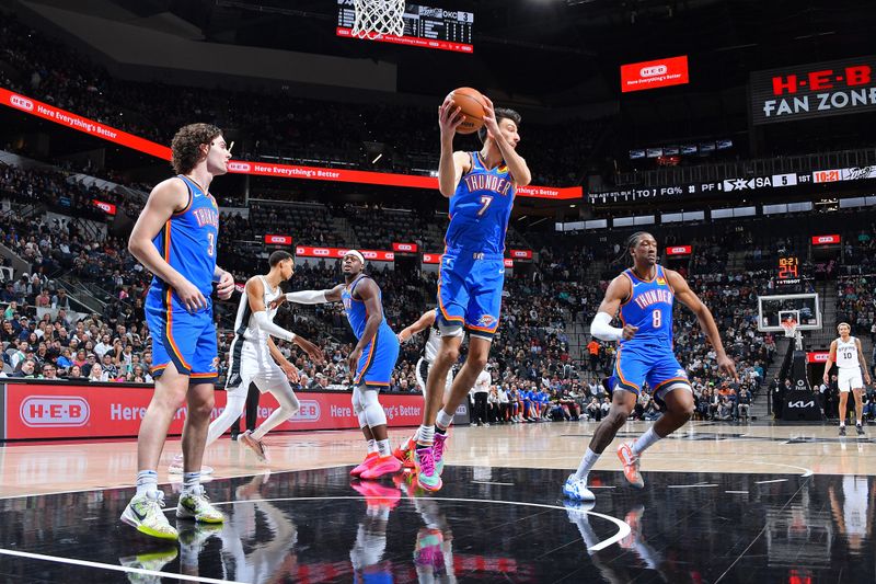 SAN ANTONIO, TX - FEBRUARY 29:  Chet Holmgren #7 of the Oklahoma City Thunder grabs a rebound during the game against the San Antonio Spurs on February 29, 2024 at the Frost Bank Center in San Antonio, Texas. NOTE TO USER: User expressly acknowledges and agrees that, by downloading and or using this photograph, user is consenting to the terms and conditions of the Getty Images License Agreement. Mandatory Copyright Notice: Copyright 2024 NBAE (Photos by Michael Gonzales/NBAE via Getty Images)