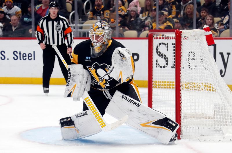 Jan 15, 2024; Pittsburgh, Pennsylvania, USA; Pittsburgh Penguins goaltender Tristan Jarry (35) guards the net against the Seattle Kraken during the second period at PPG Paints Arena. Mandatory Credit: Charles LeClaire-USA TODAY Sports